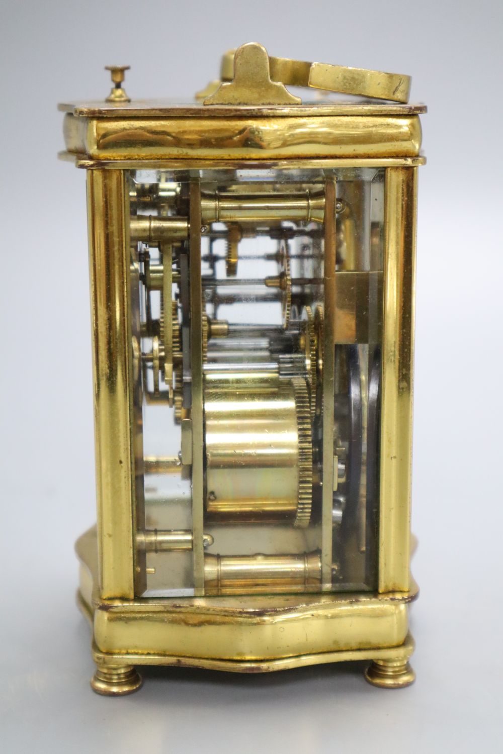 A brass cased carriage clock, height 14cm with handle down